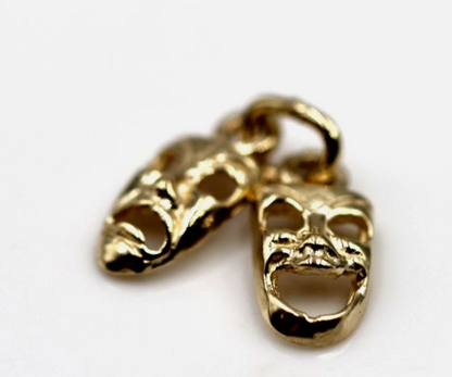 Front view of yellow gold comedy and tragedy theatre masks pendant charm